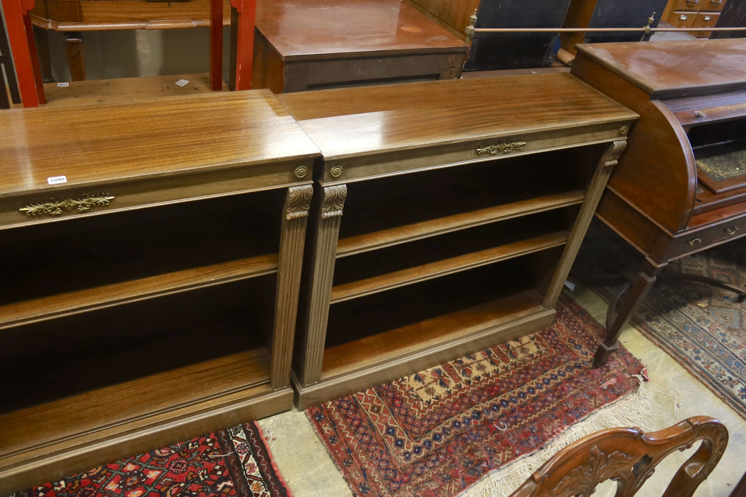 A pair of Regency style faded mahogany gilt metal mounted dwarf open bookcases, width 107cm, depth 34cm, height 93cm